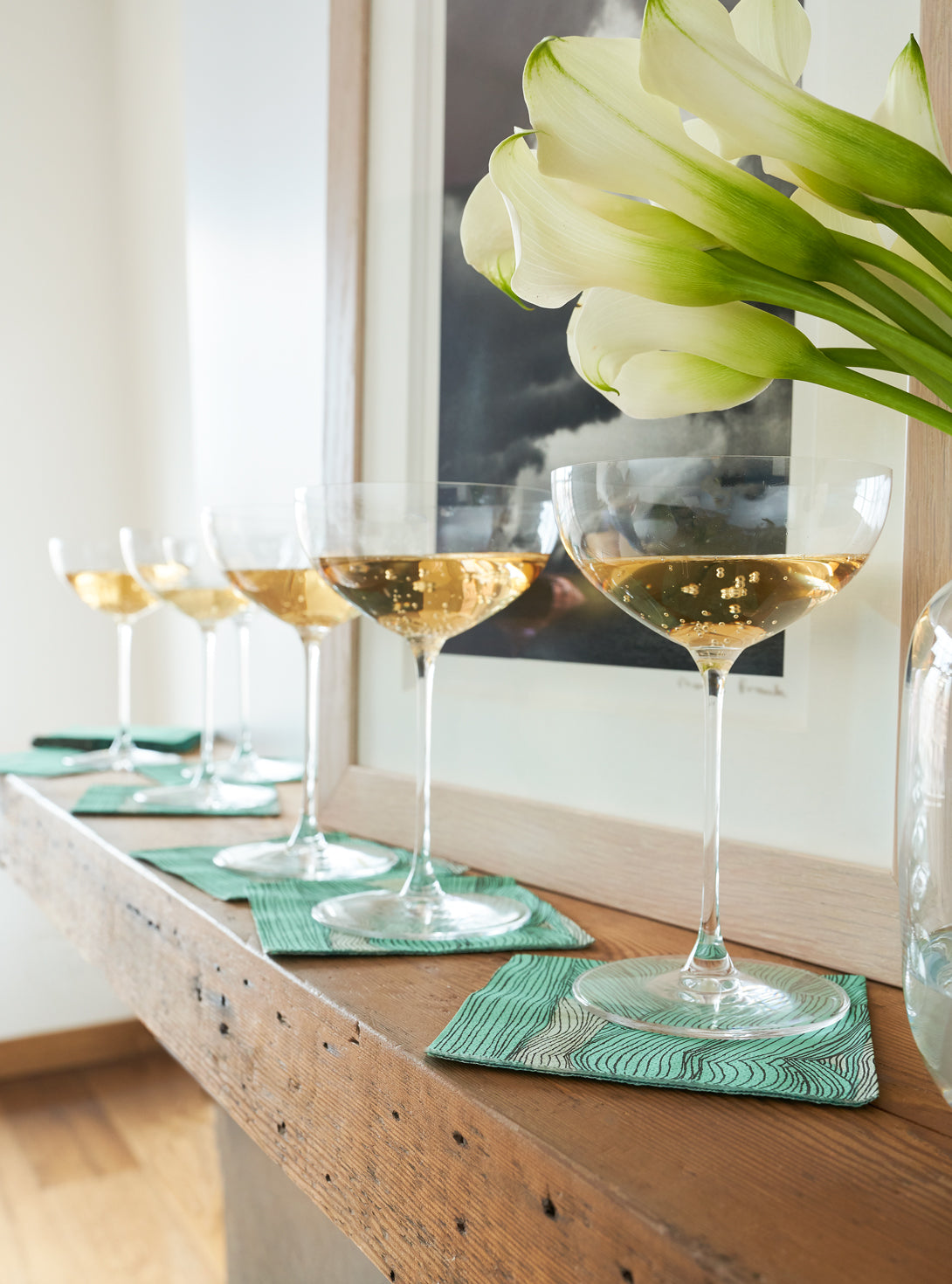 Green, black and off-white cocktail napkin with abstract pattern