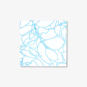 White cocktail napkin with blue floral design