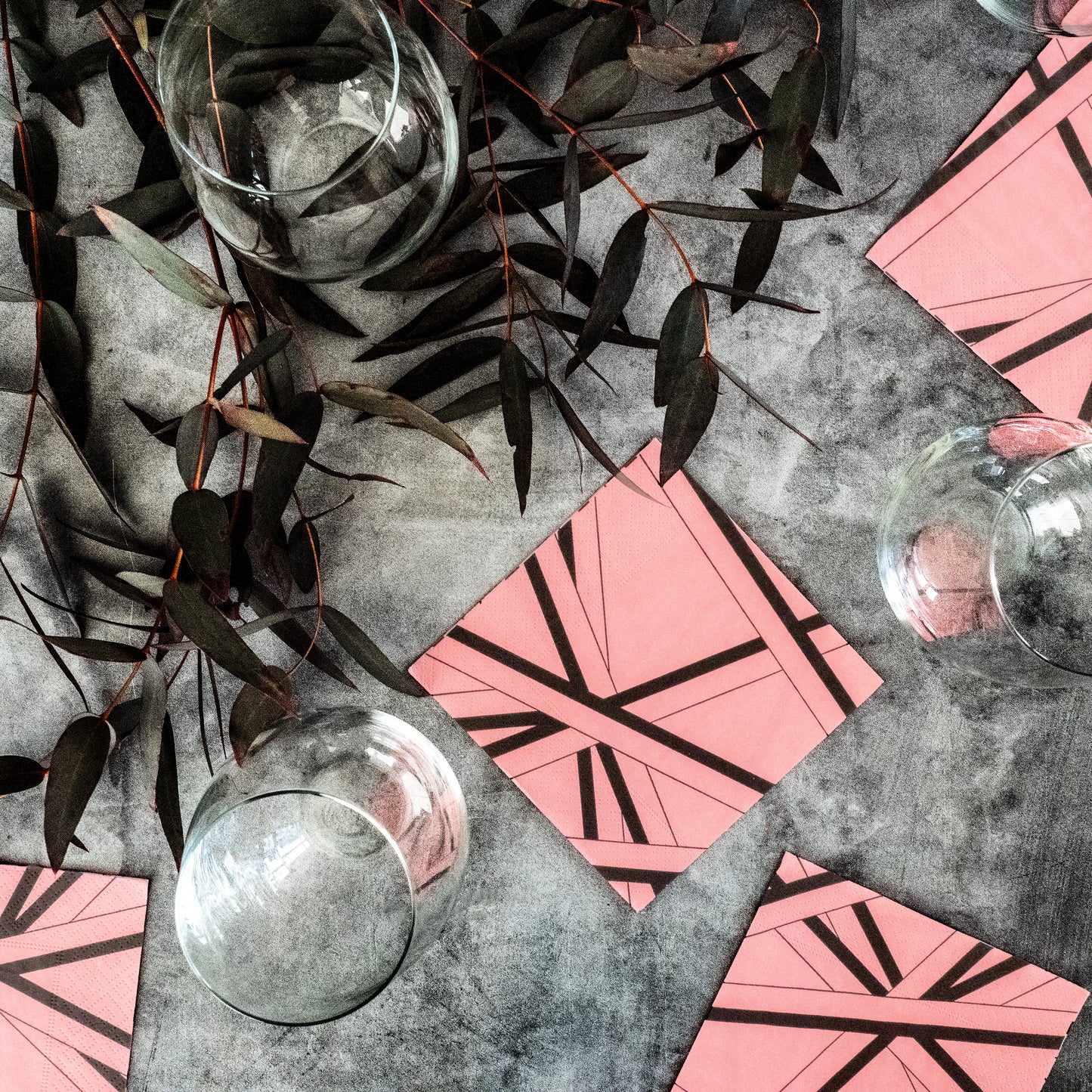 Pink cocktail napkin with black striped pattern