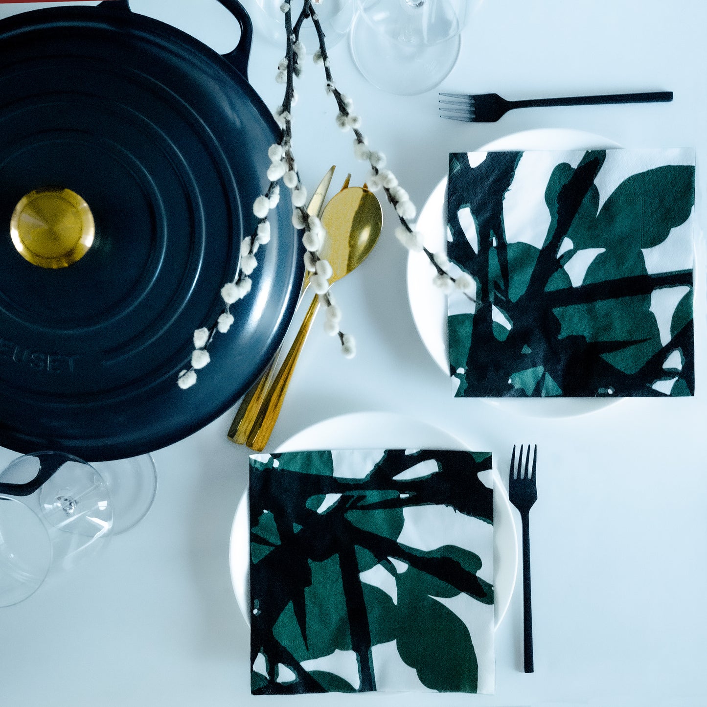 White dinner napkin with green and black design