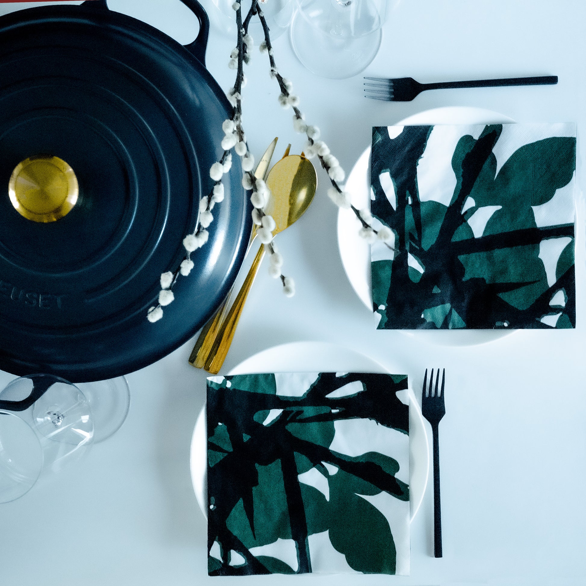 White dinner napkin with green and black design