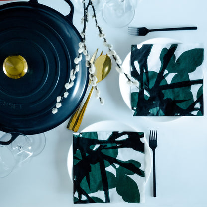 White dinner napkin with green and black design