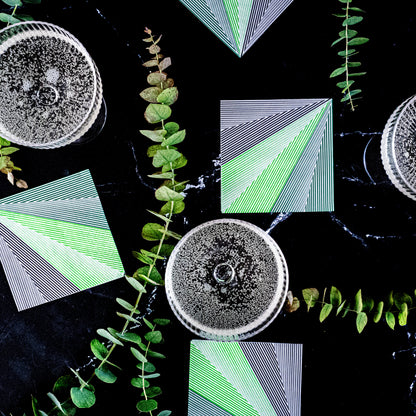 Green, black and white cocktail napkin with striped pattern