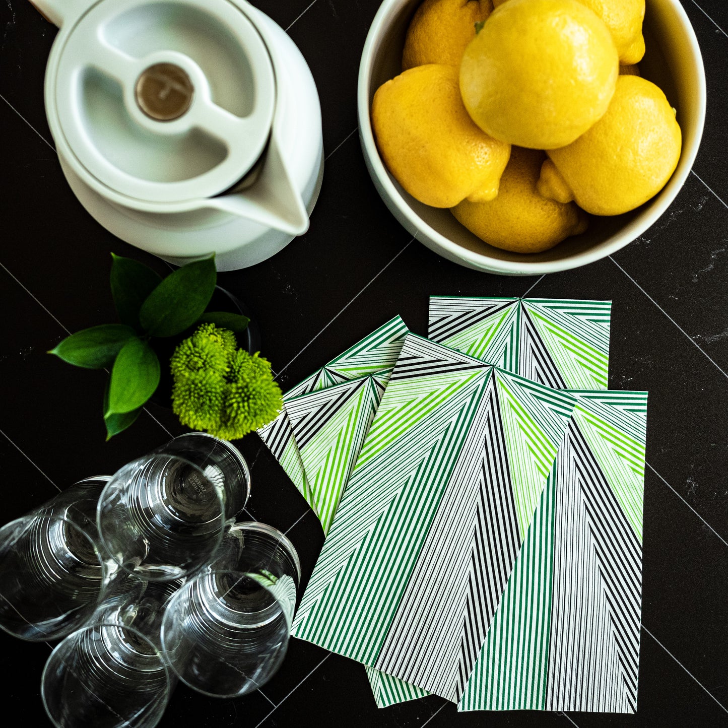 Green, black and white guest towel napkin with striped pattern