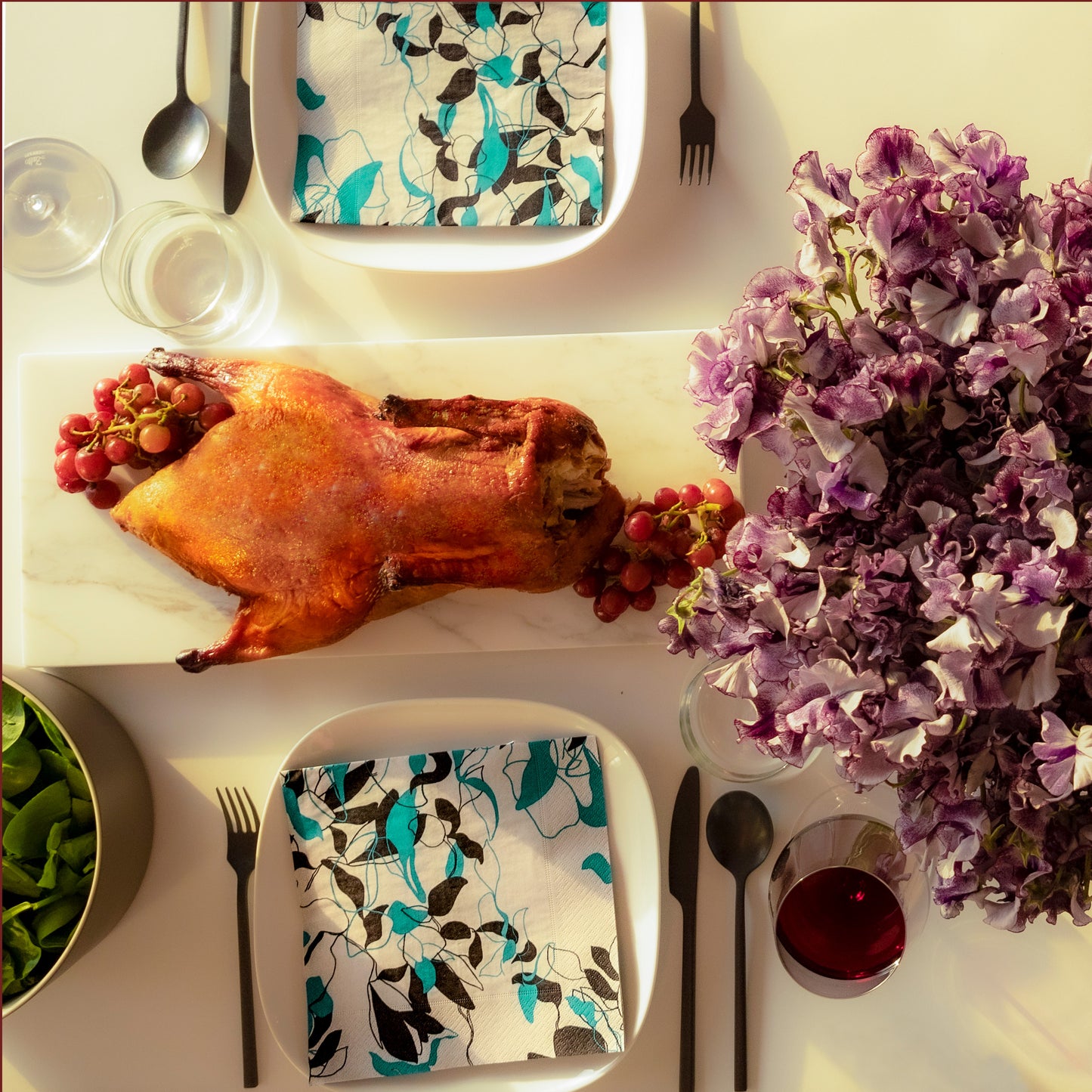 Teal, black and gray dinner napkin with floral/leaf pattern
