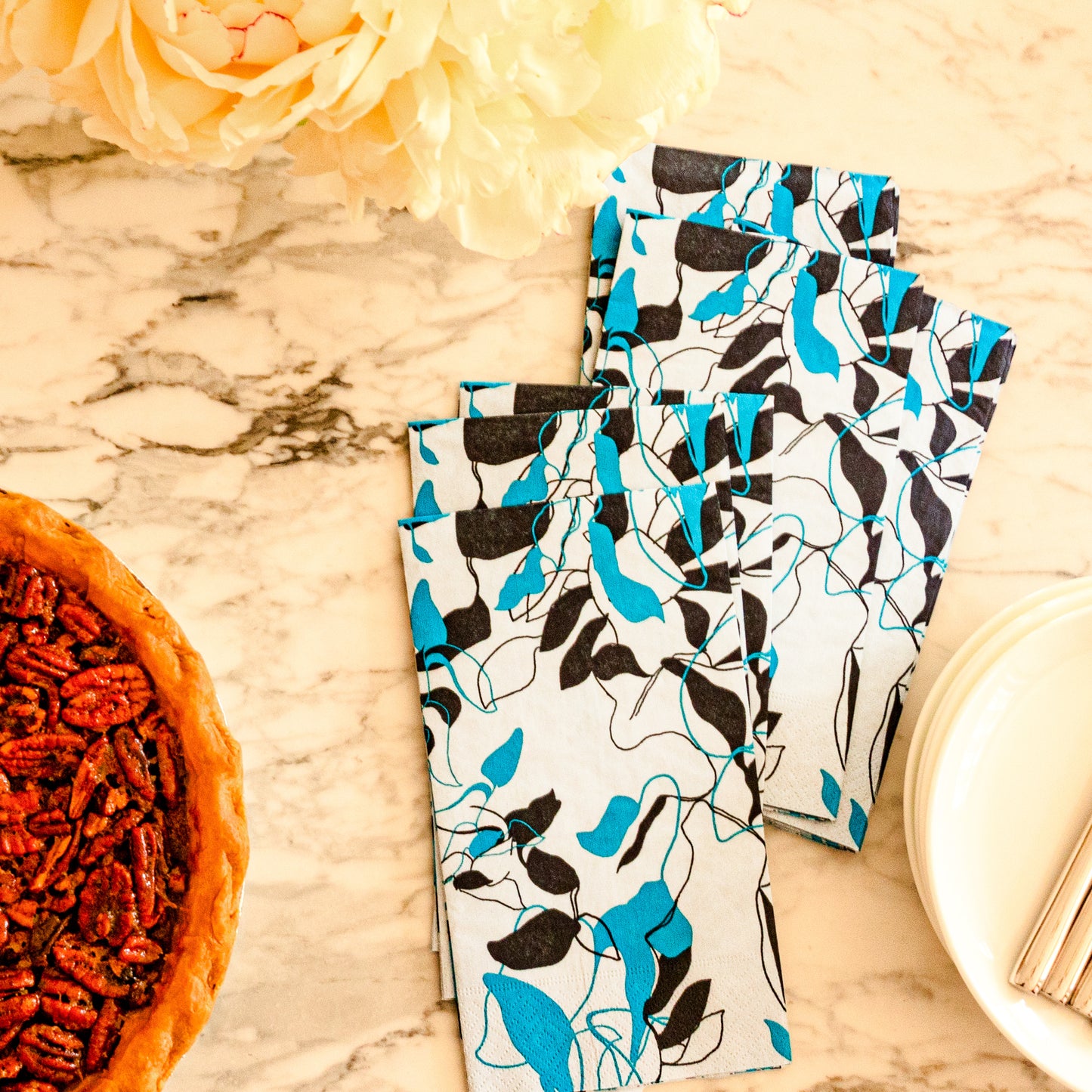 Teal, black and gray guest towel napkin with floral/leaf pattern