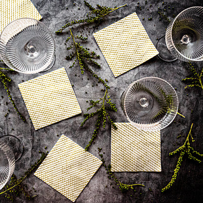White cocktail napkin with gold abstract pattern