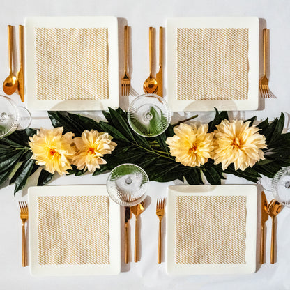 White dinner napkin with gold abstract pattern