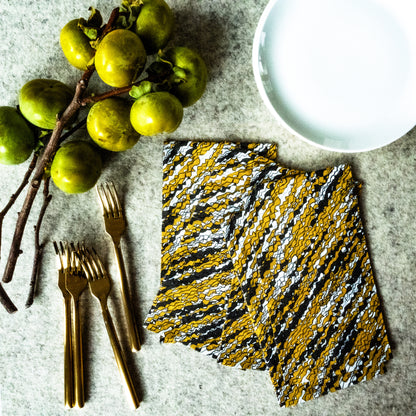 Gold, black and white guest towel napkin with abstract pattern