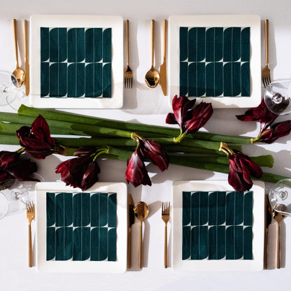 Teal and white dinner napkin with abstract design