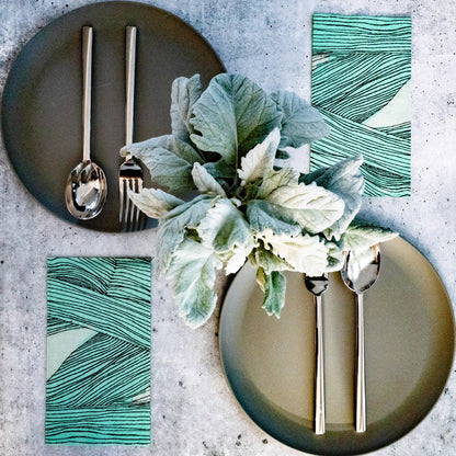 Green, black and off-white guest towel napkin with abstract pattern