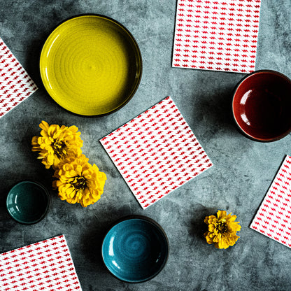 White cocktail napkin with red lightning bolt pattern