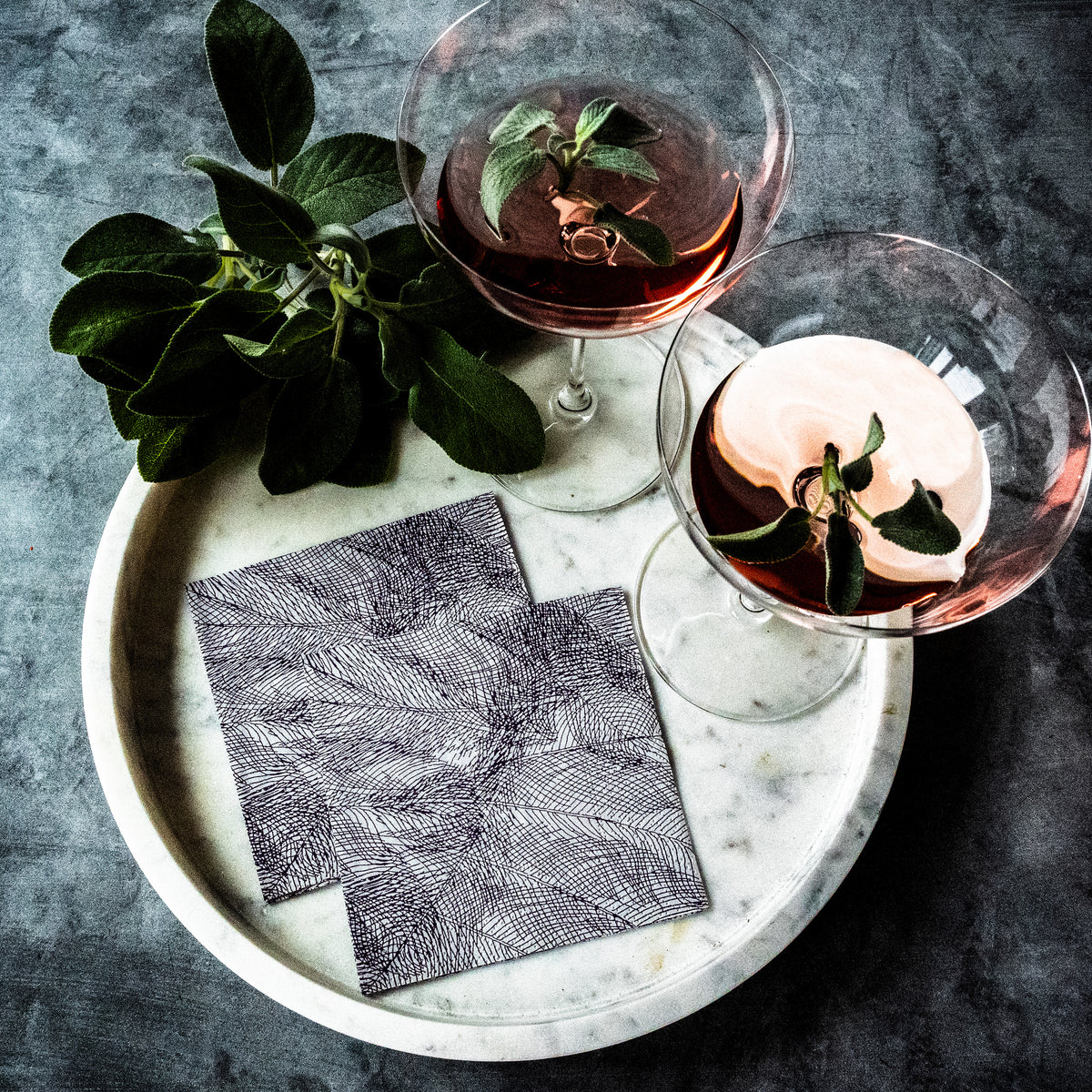 Gray and purple cocktail napkin with abstract pattern