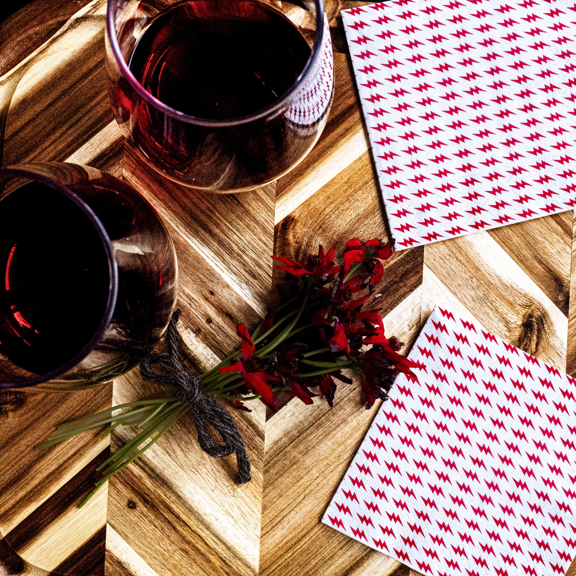 White cocktail napkin with red lightning bolt pattern
