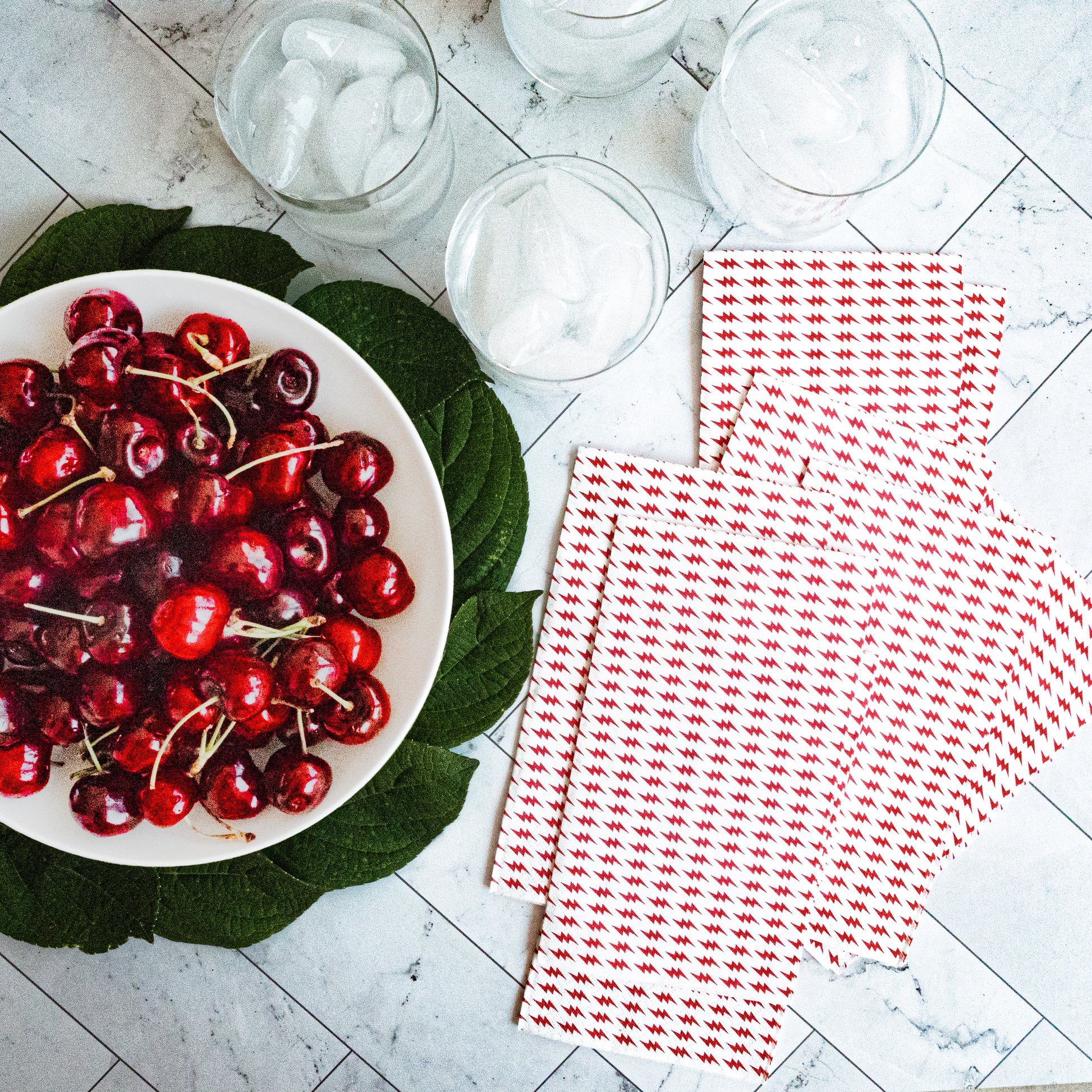 White guest towel napkin with red lightning bolt pattern