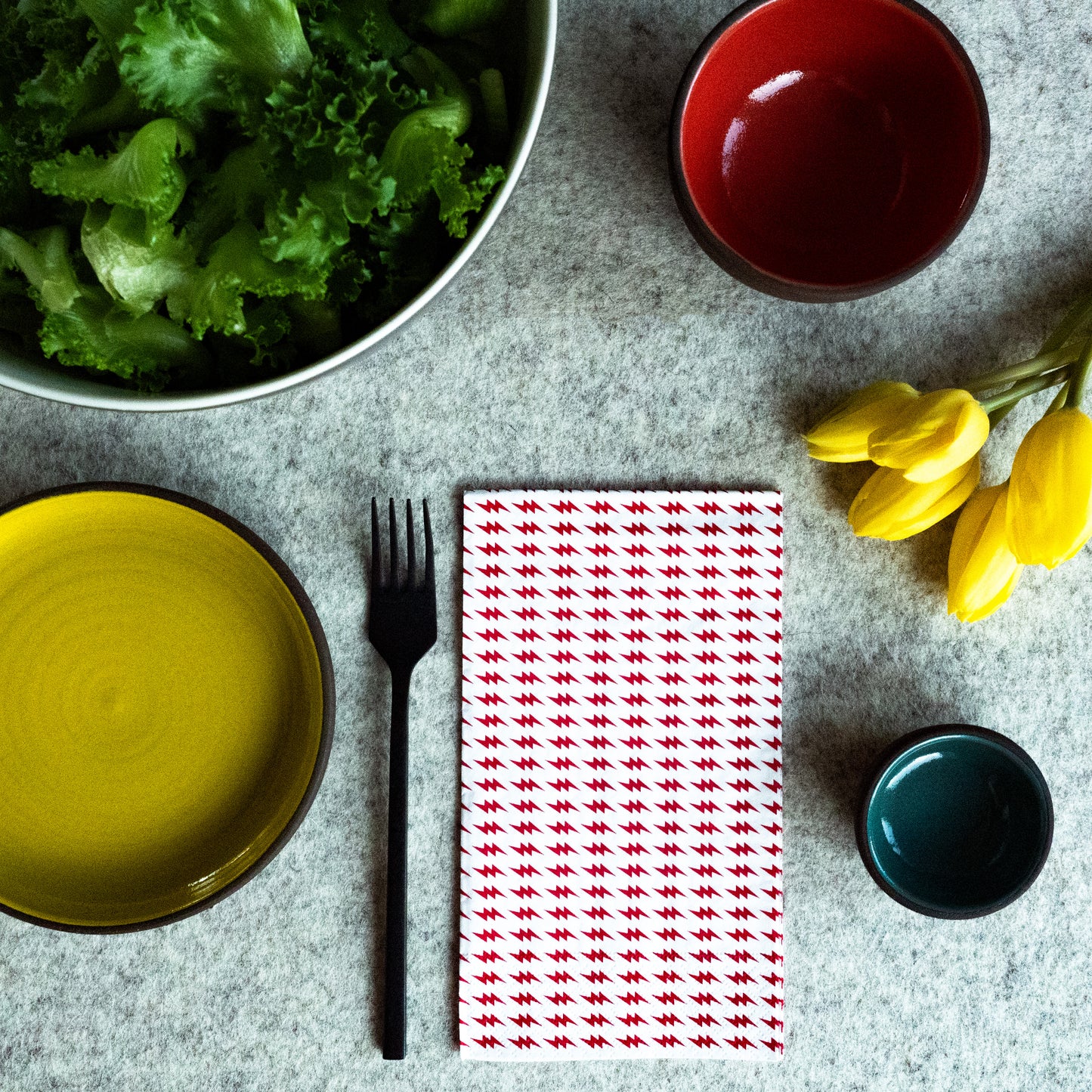 White guest towel napkin with red lightning bolt pattern