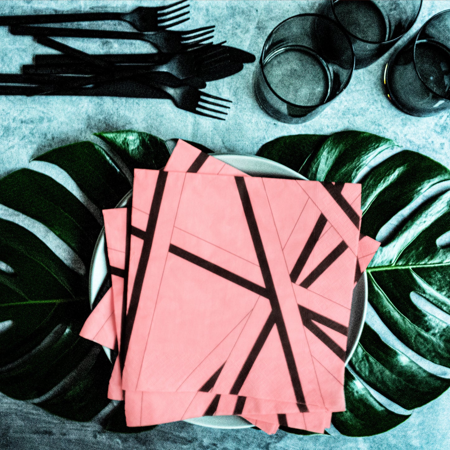 Pink dinner napkin with black striped pattern