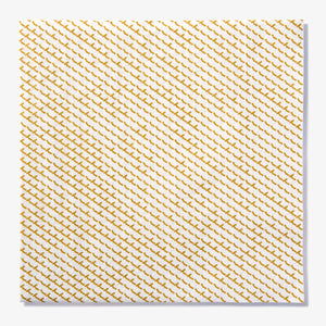 White dinner napkin with gold abstract pattern