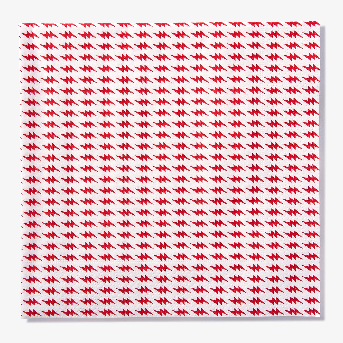 White dinner napkin with red lightning bolt pattern