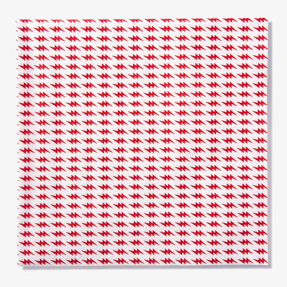 White dinner napkin with red lightning bolt pattern