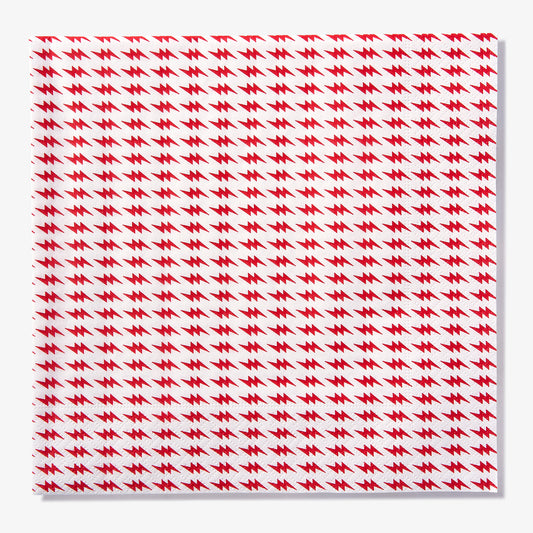 White dinner napkin with red lightning bolt pattern