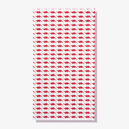 White guest towel napkin with red lightning bolt pattern