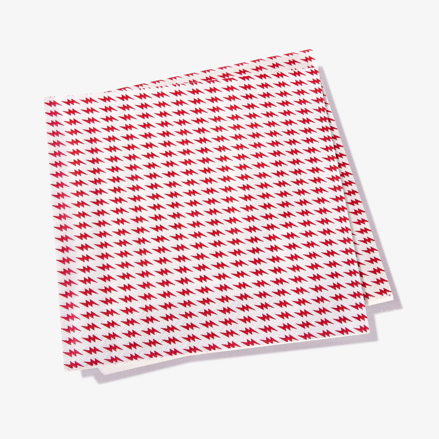 White dinner napkin with red lightning bolt pattern