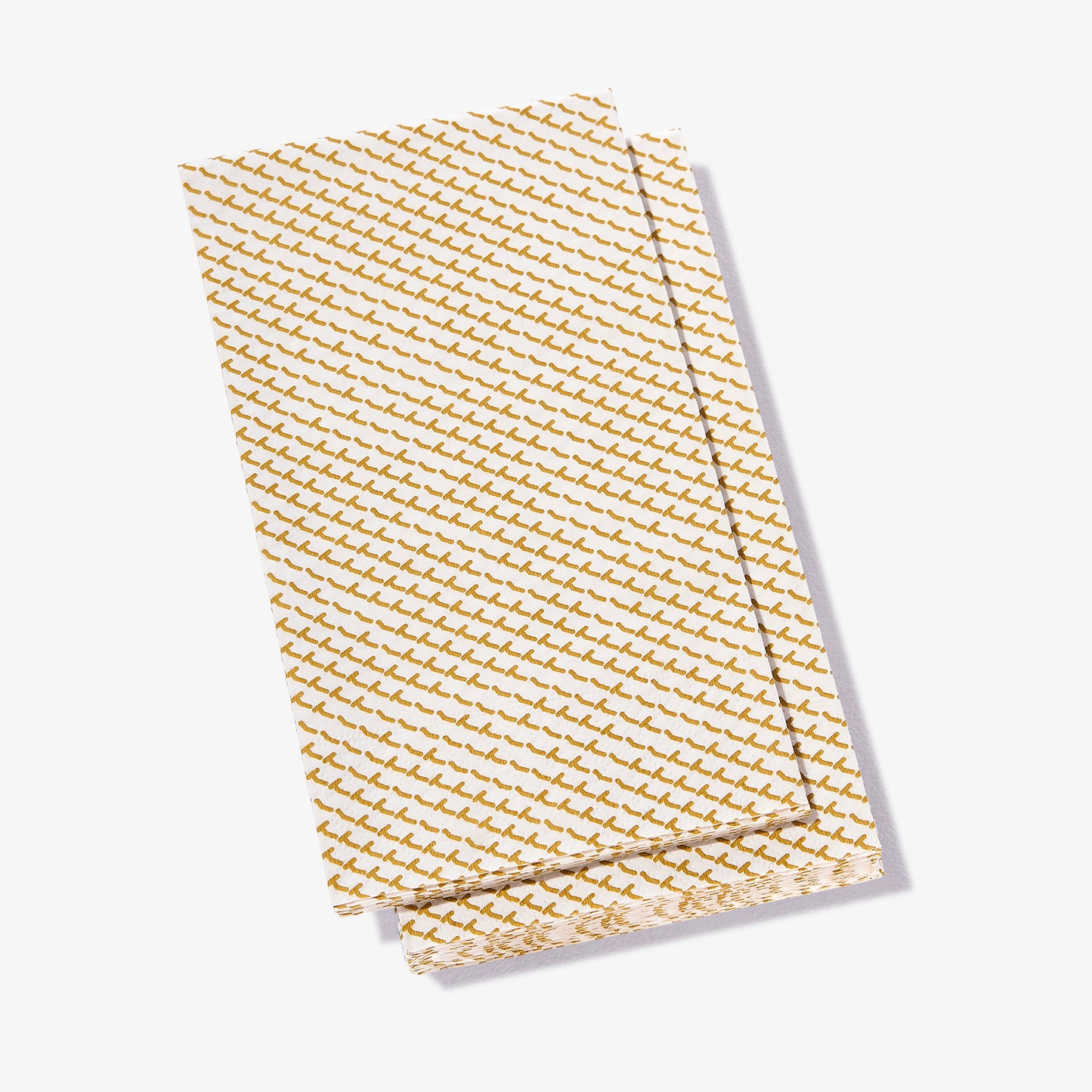 White guest towel napkin with gold abstract pattern