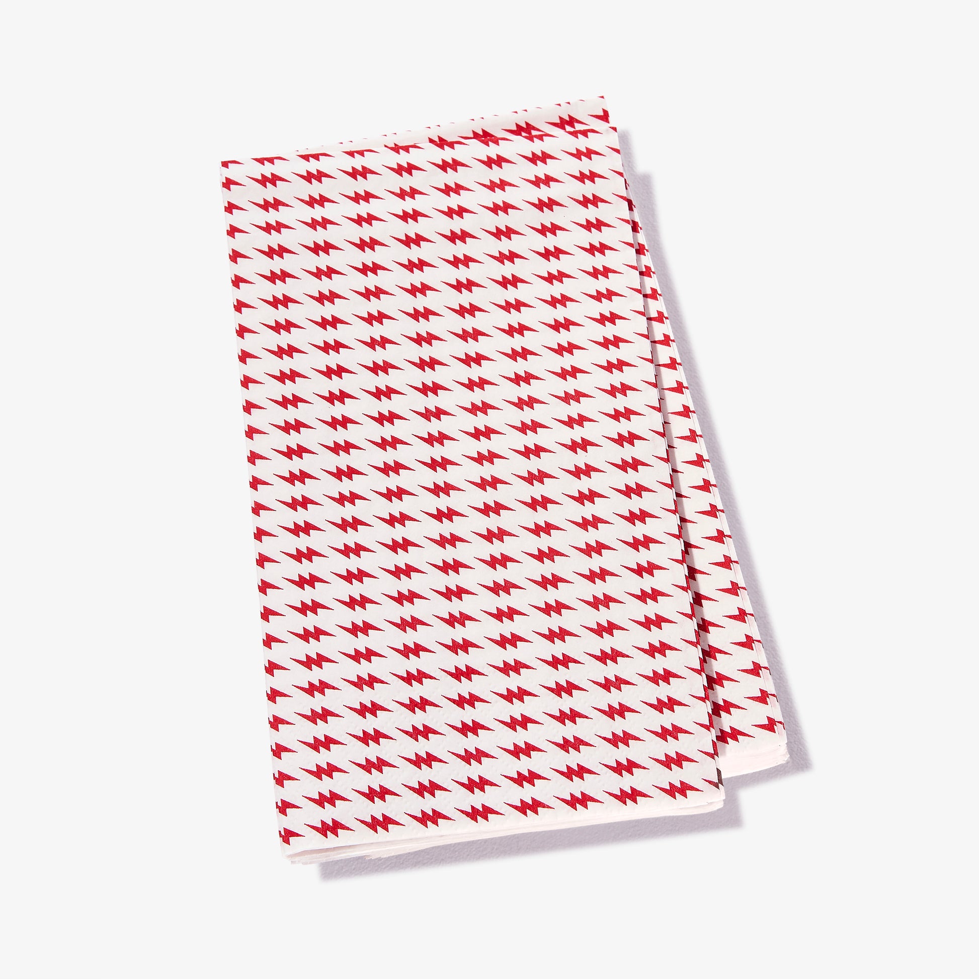 White guest towel napkin with red lightning bolt pattern