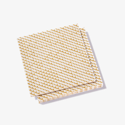 White cocktail napkin with gold abstract pattern