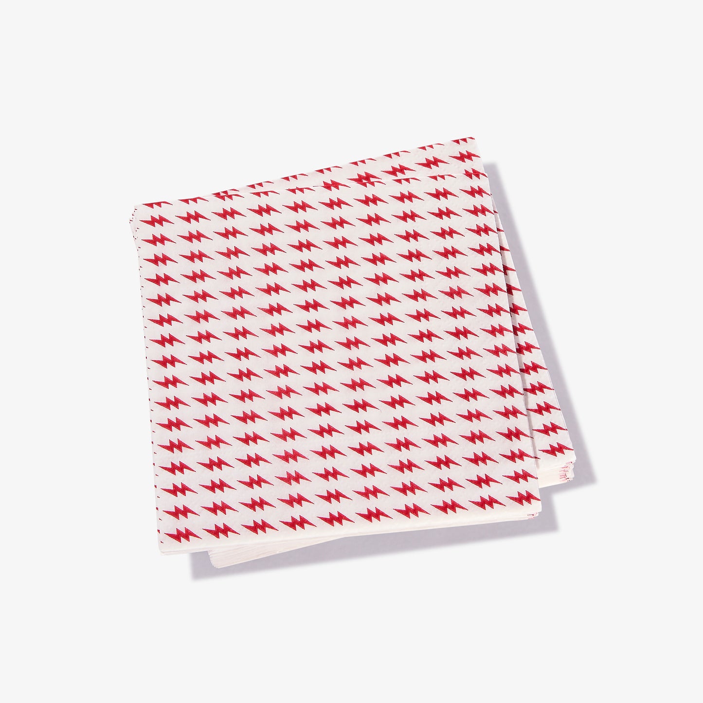 White cocktail napkin with red lightning bolt pattern