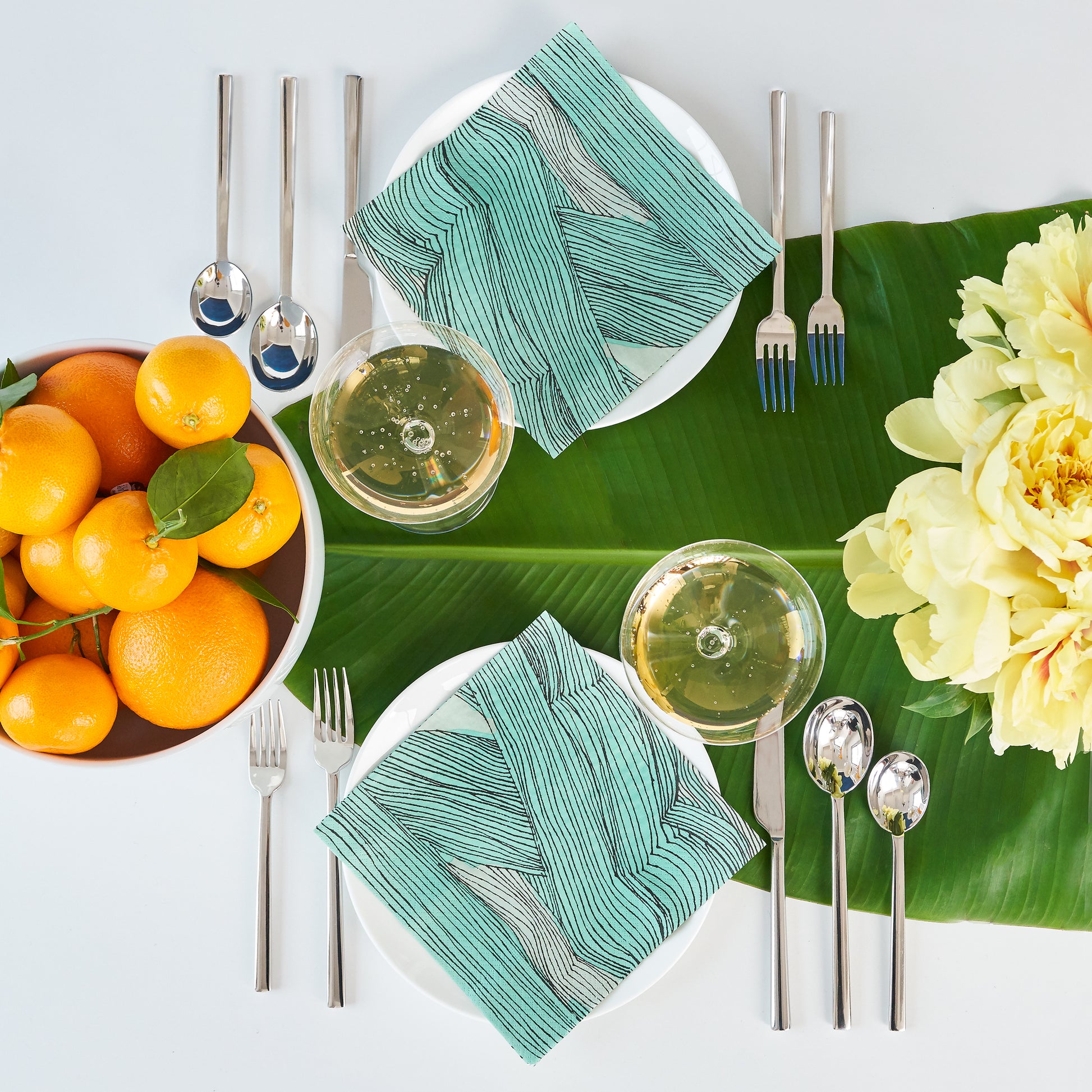 Green, black and off-white dinner napkin with abstract pattern