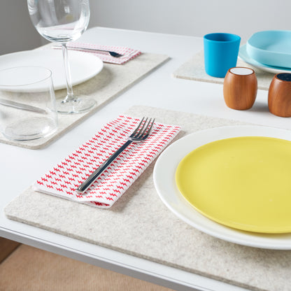 White dinner napkin with red lightning bolt pattern