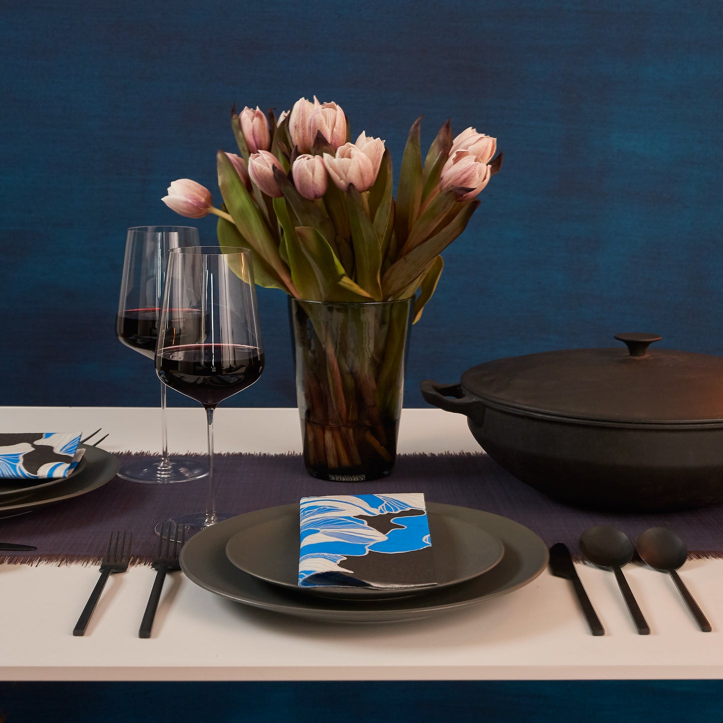 Blue, gray, white and black dinner napkin with floral pattern