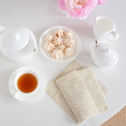 White dinner napkin with gold abstract pattern