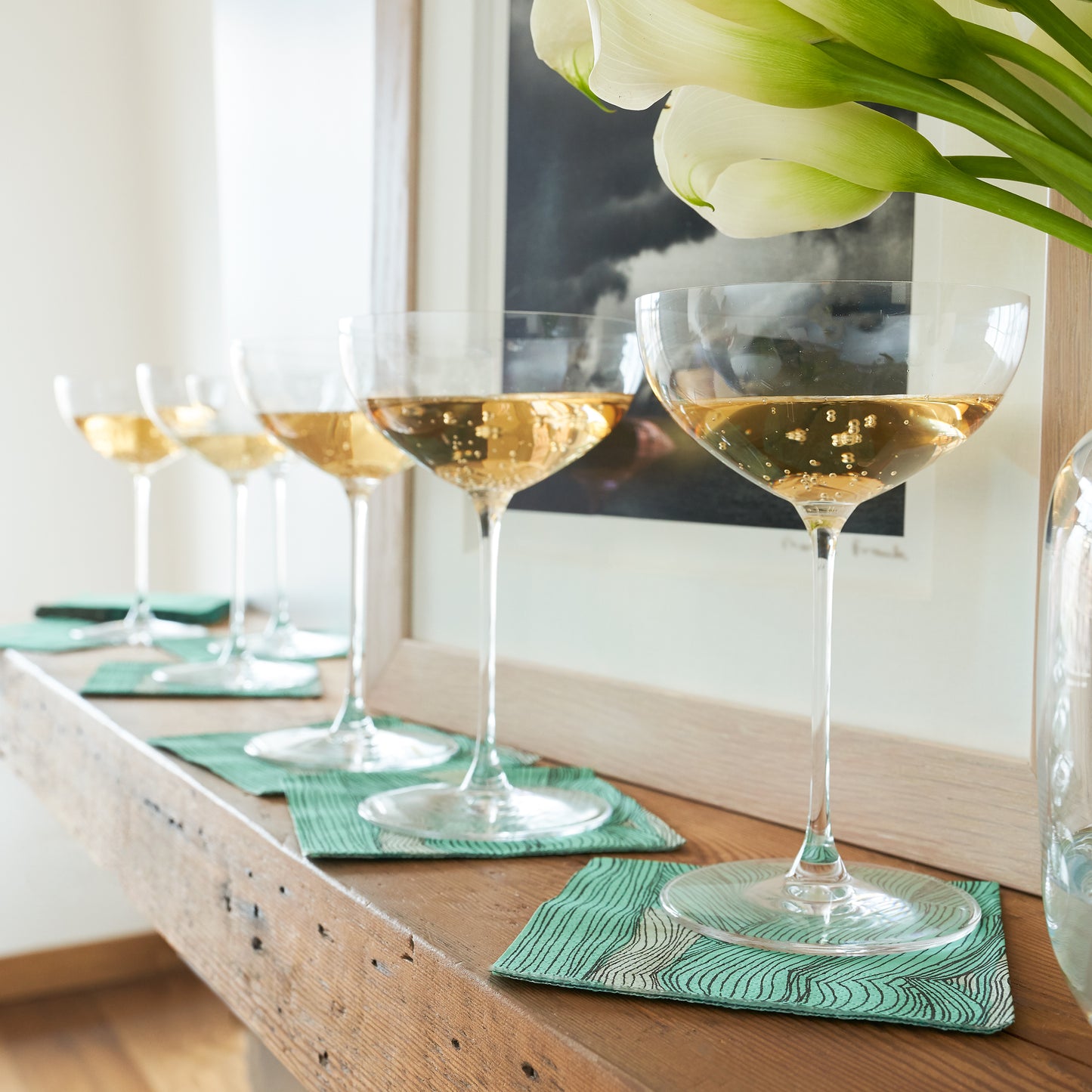 Green, black and off-white cocktail napkin with abstract pattern