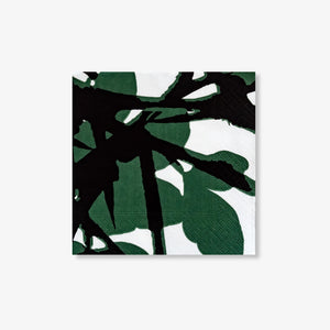 White cocktail napkin with green and black design