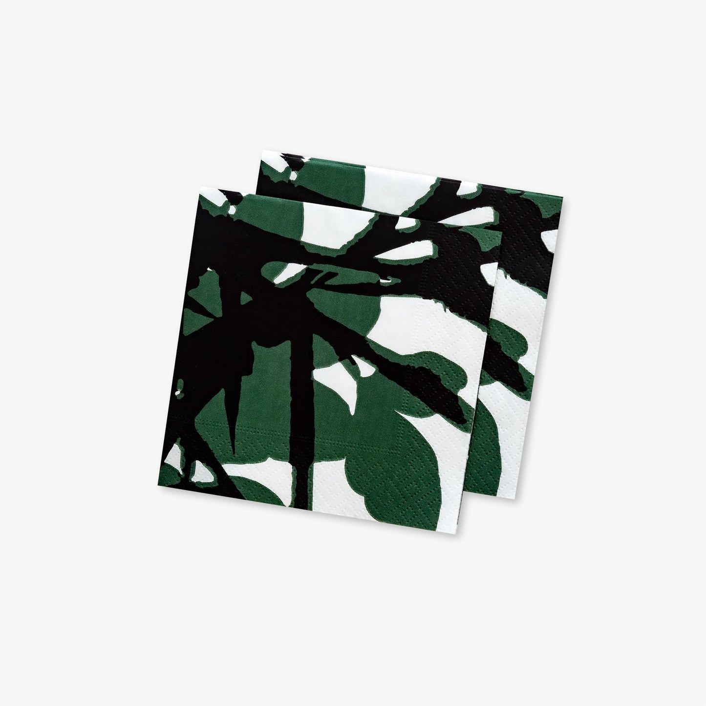 White cocktail napkin with green and black design