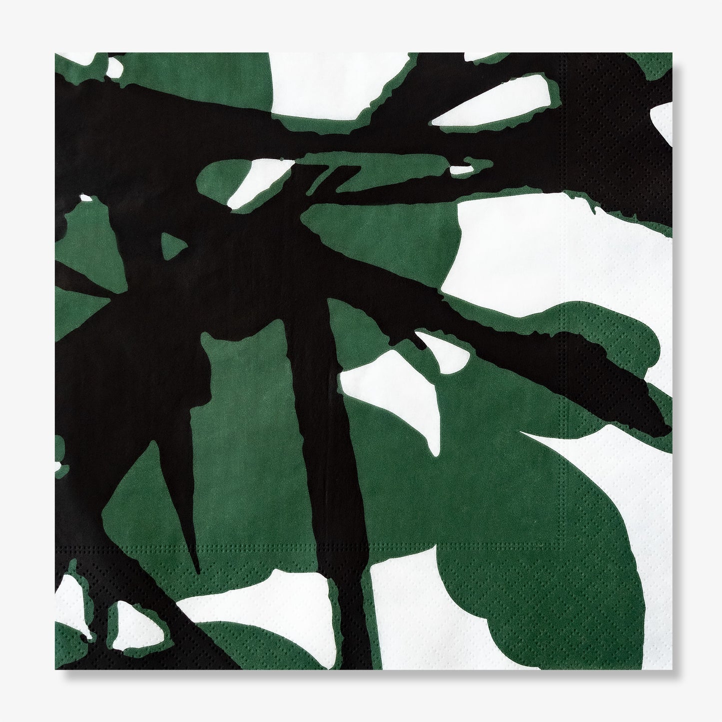 White dinner napkin with green and black design