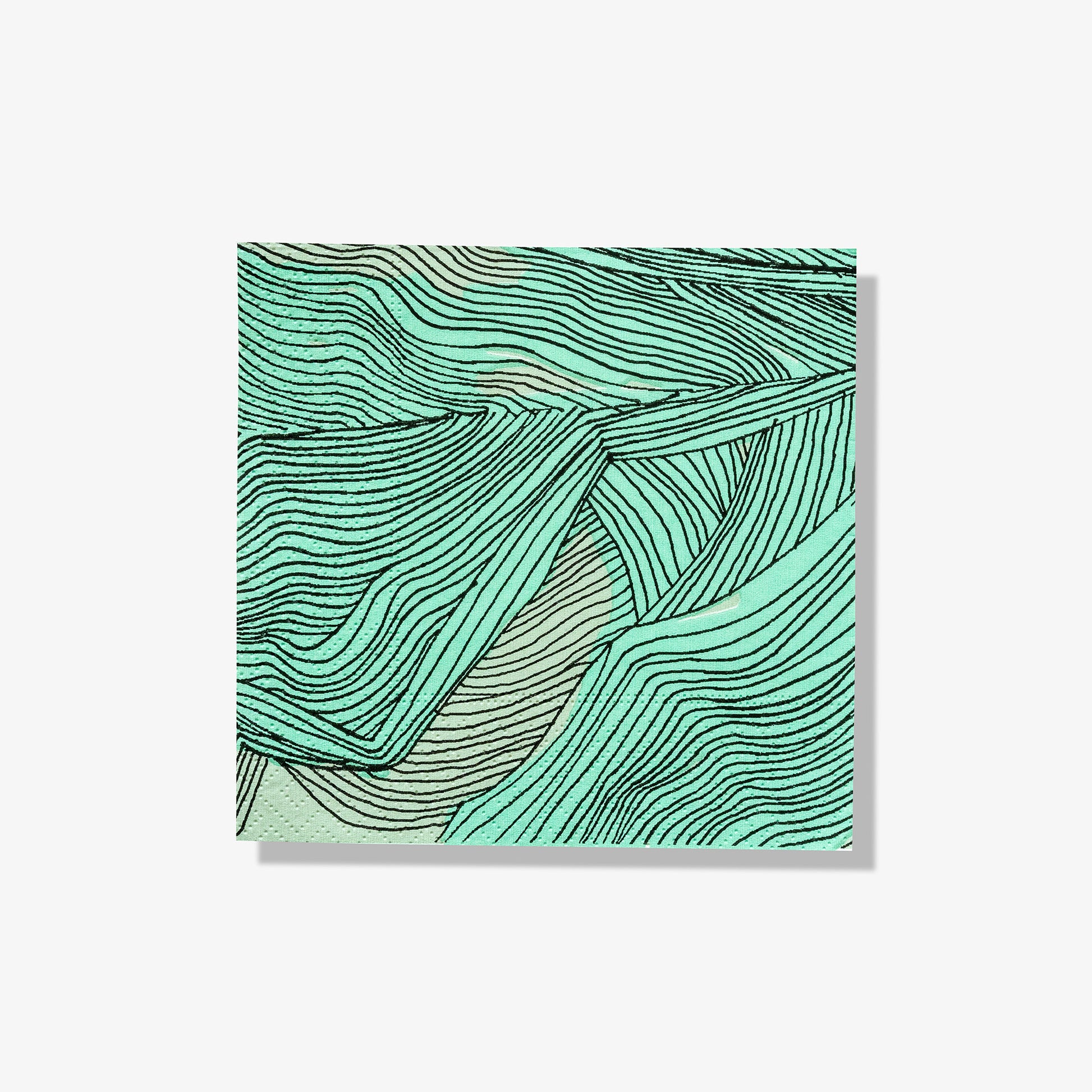 Green, black and off-white cocktail napkin with abstract pattern