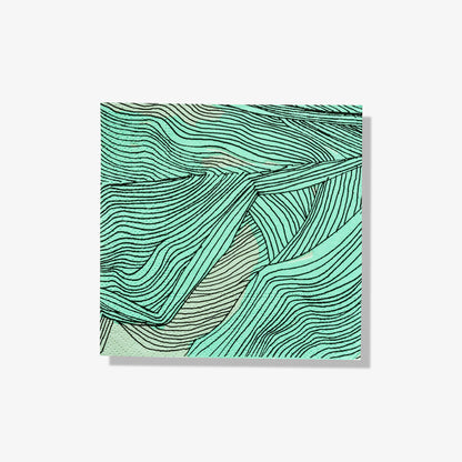 Green, black and off-white cocktail napkin with abstract pattern