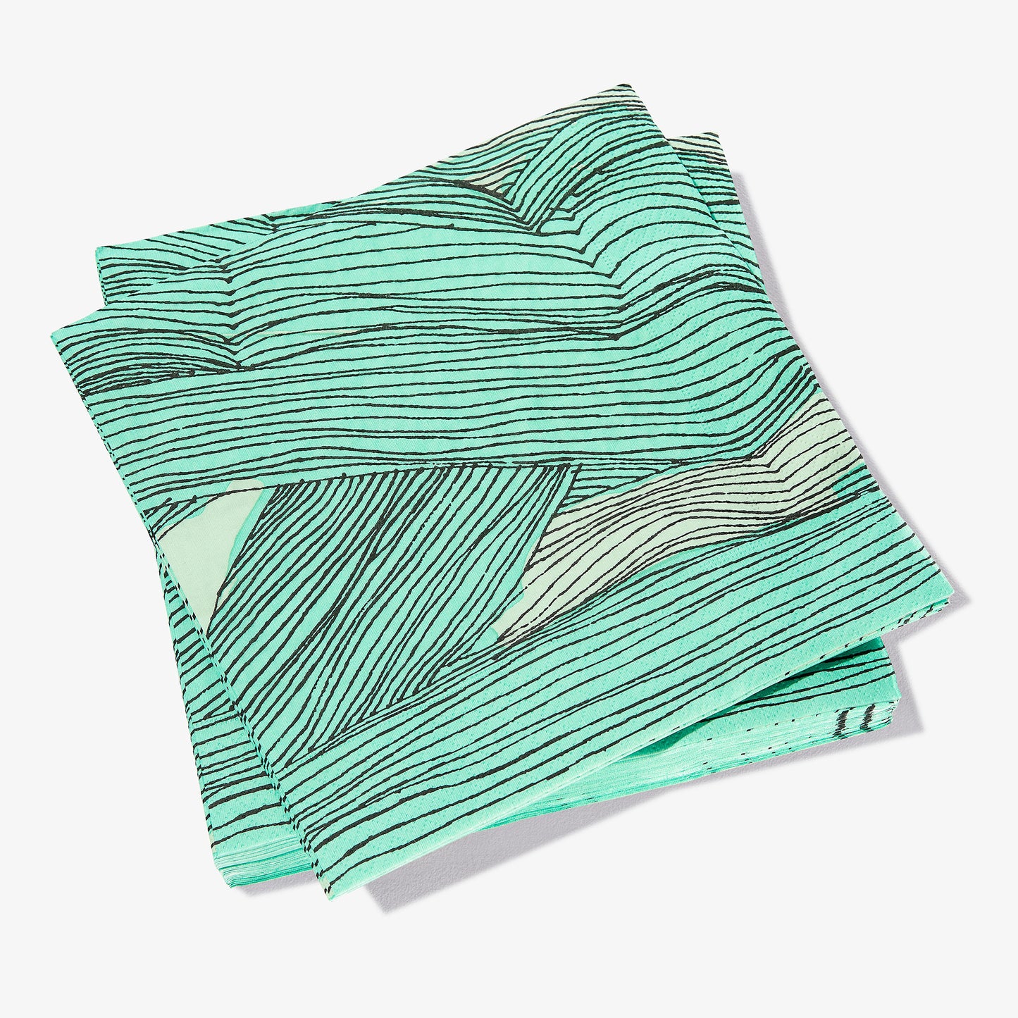 Green, black and off-white dinner napkin with abstract pattern