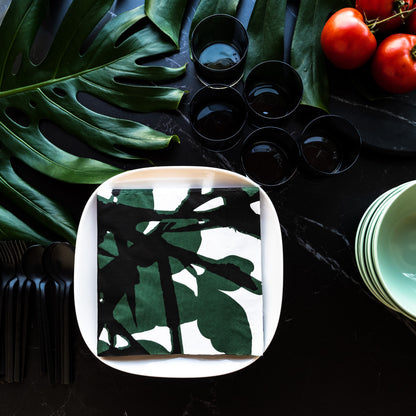 White dinner napkin with green and black design