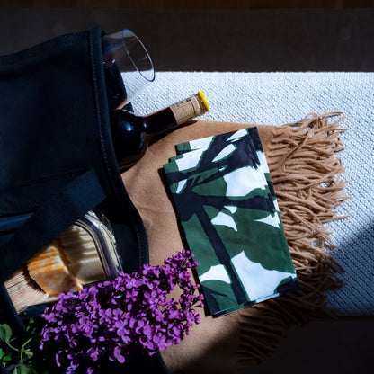 White guest towel napkin with green and black design