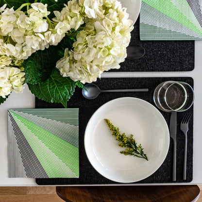 Green, black and white dinner napkin with striped pattern