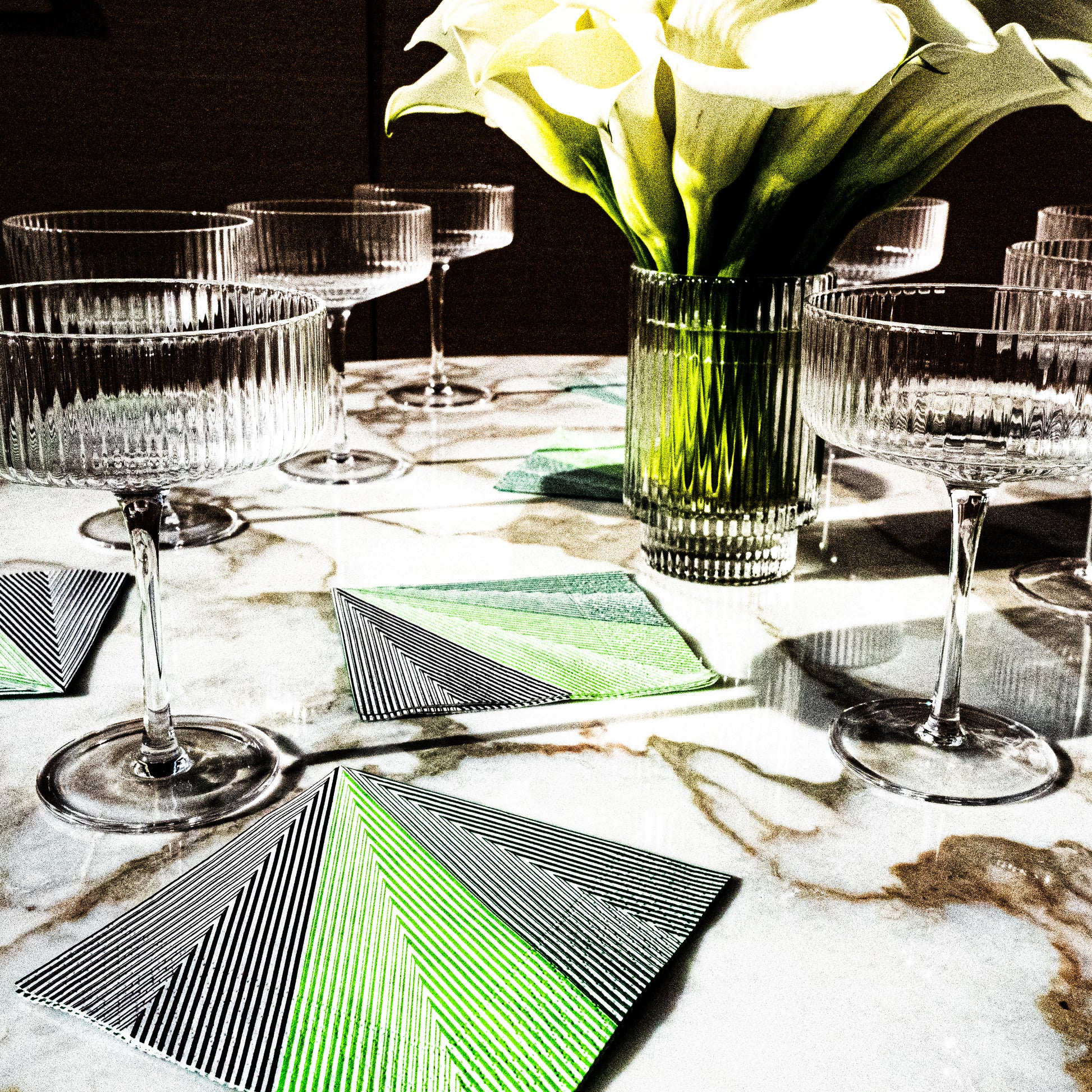 Green, black and white cocktail napkin with striped pattern
