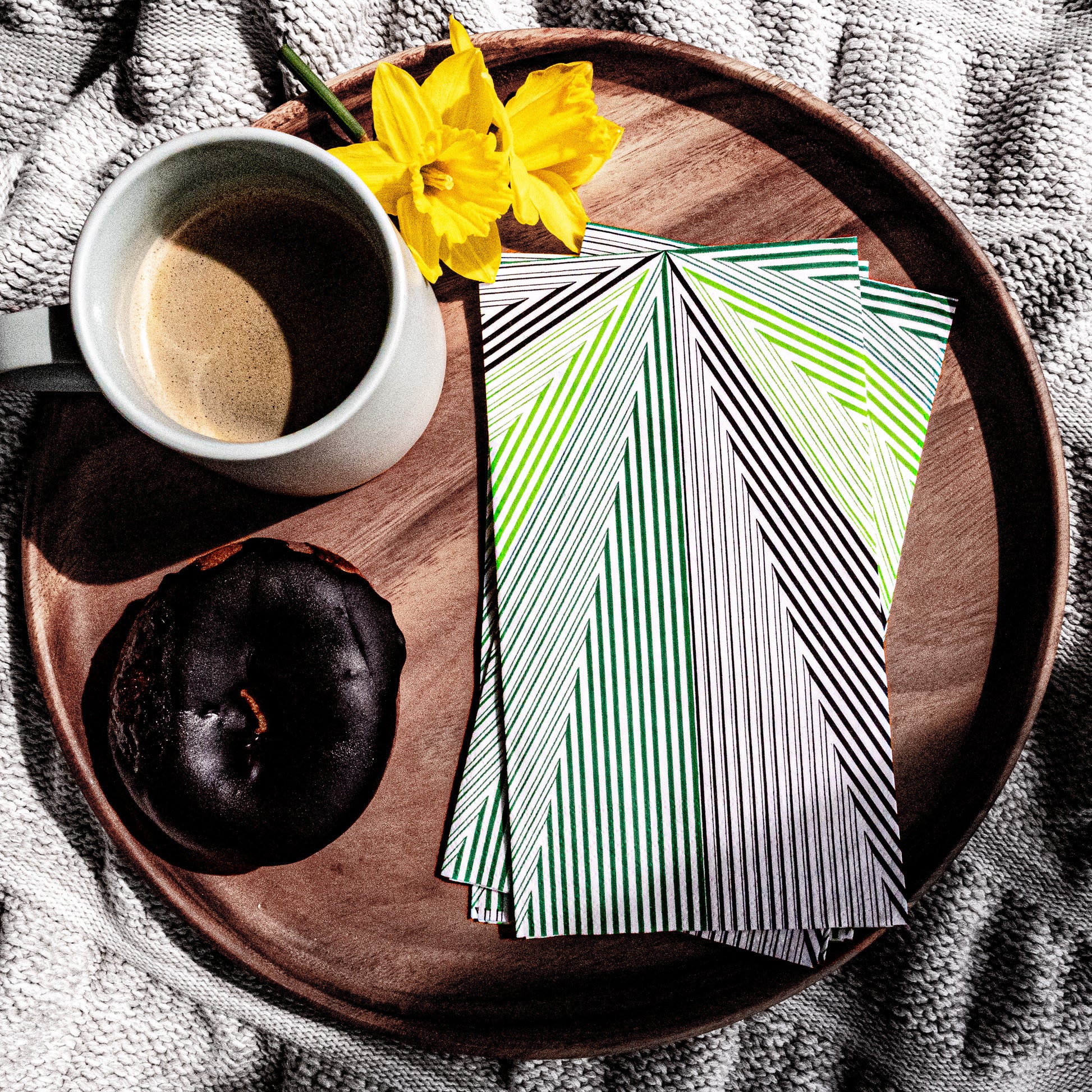 Green, black and white guest towel napkin with striped pattern