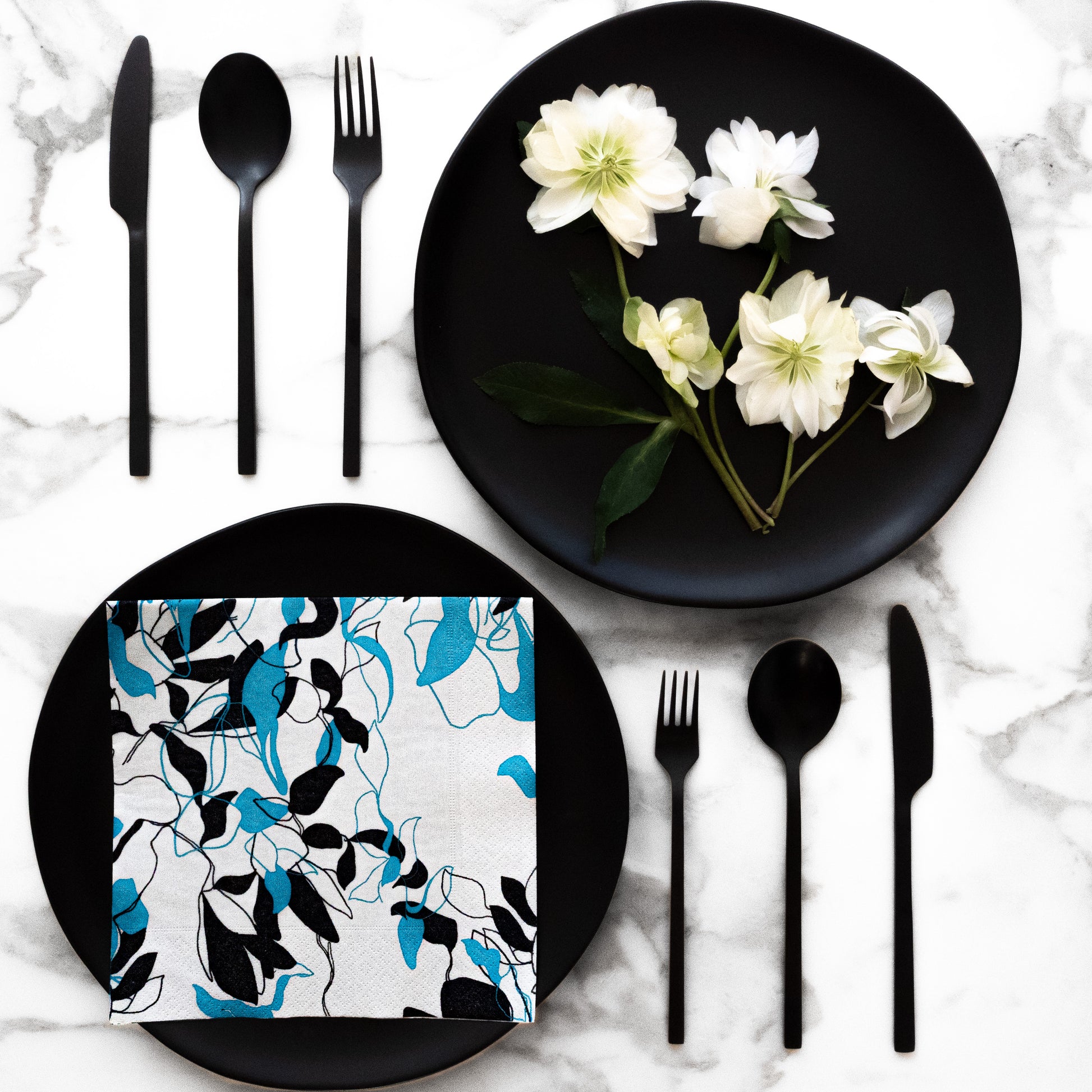 Teal, black and gray dinner napkin with floral/leaf pattern
