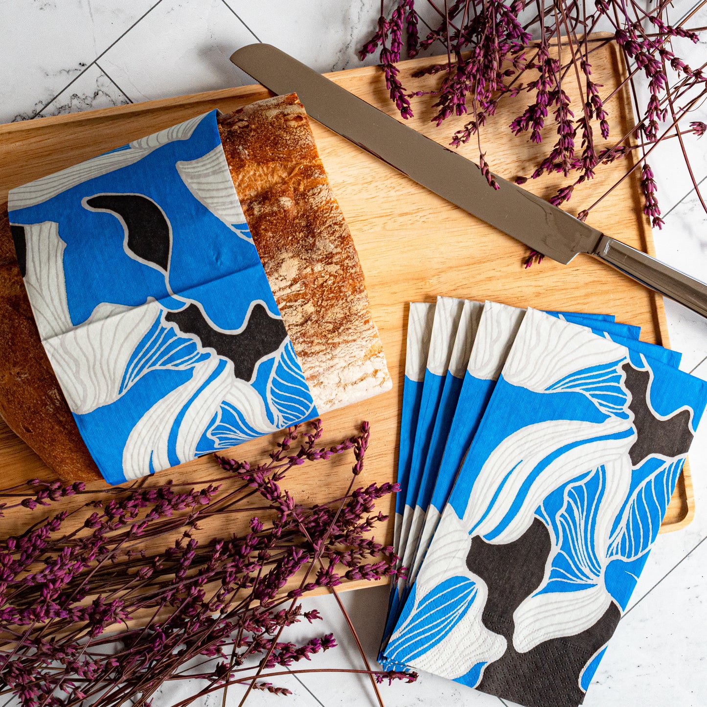 Blue, gray, white and black guest towel napkin with floral pattern