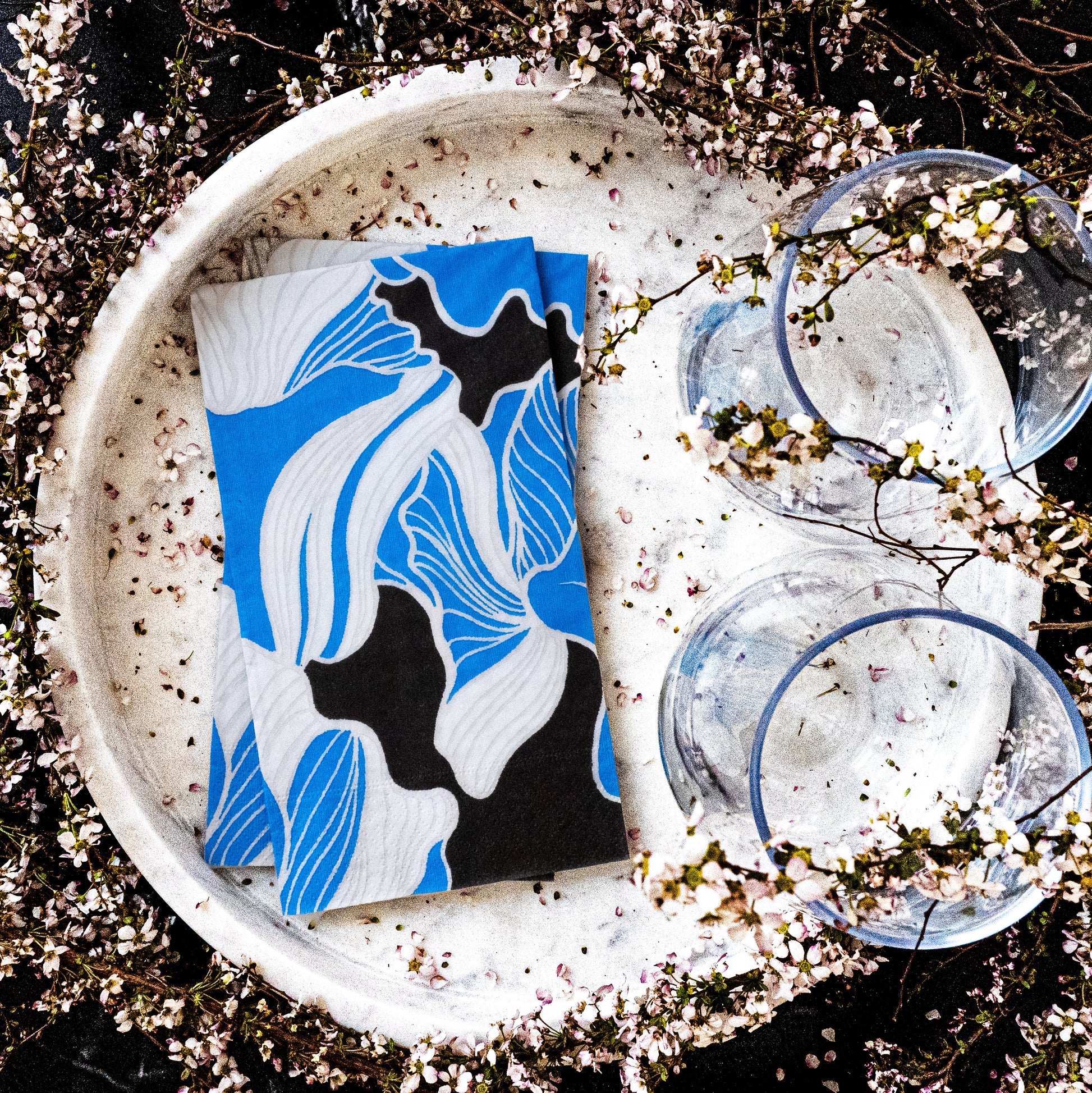 Blue, gray, white and black guest towel napkin with floral pattern